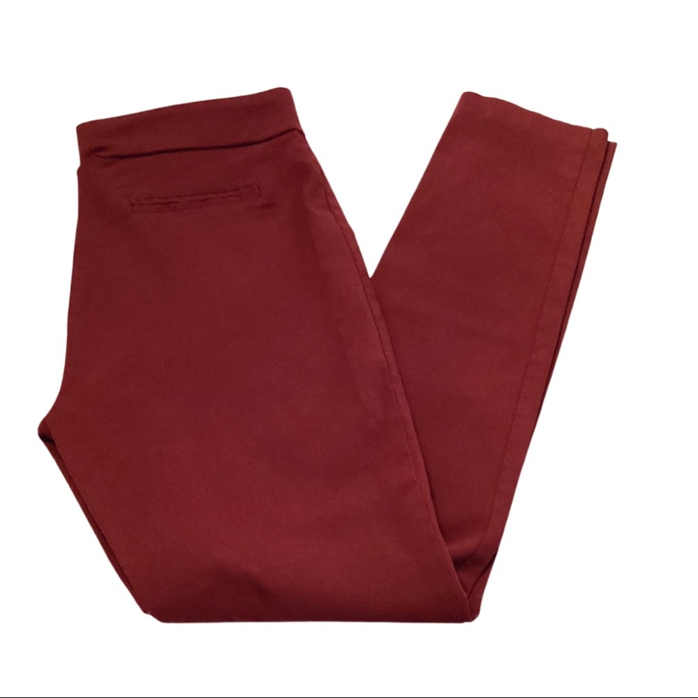 Wine colored, slim-fit slacks.